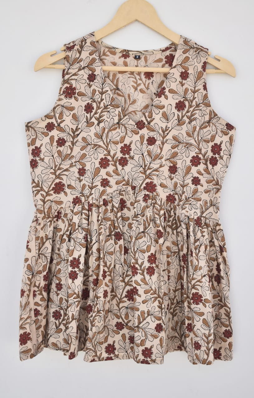 beige, reddish-brown, and brown hand-block printed, floral vine pattern cotton sleeveless peplum top