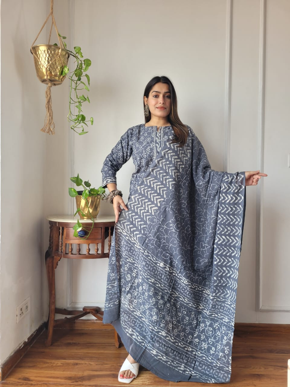 grey and white hand block printed cotton kurta, pants, and dupatta suit set.