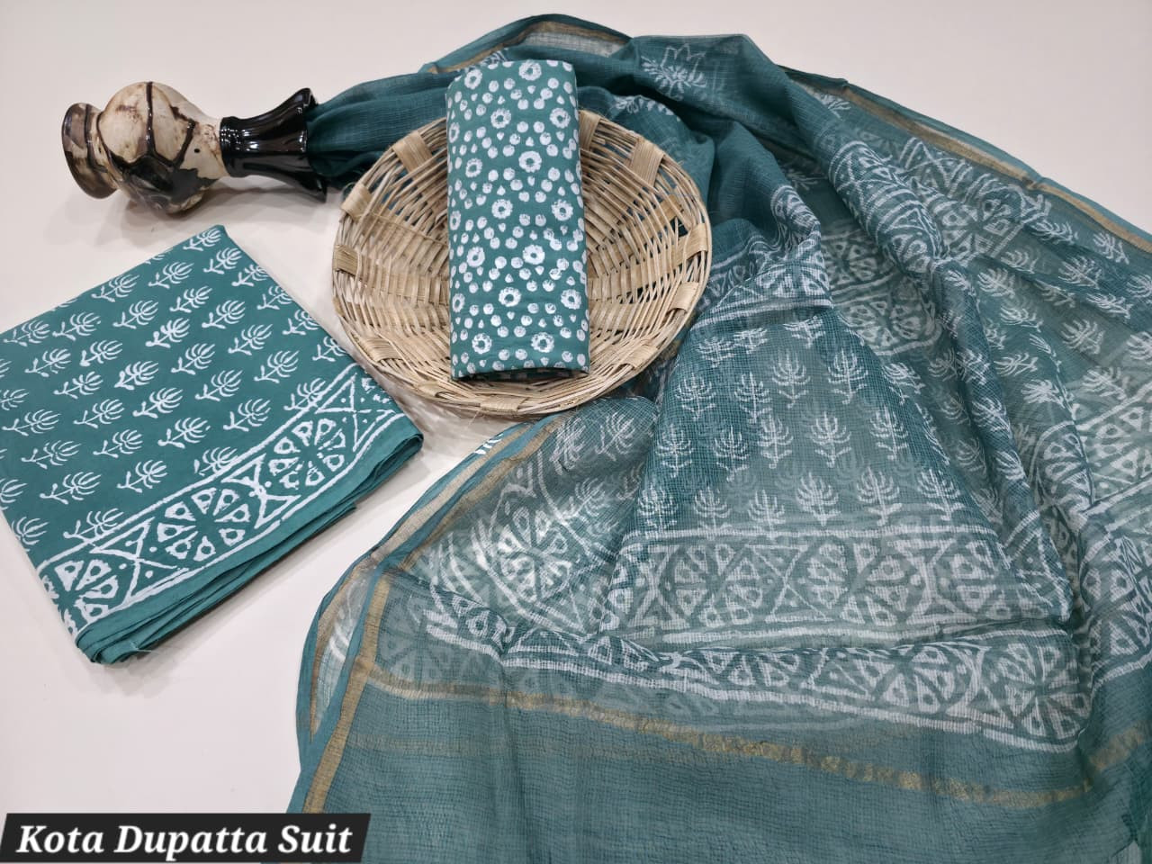 Teal Dabu Hand Block Printed Cotton Suit with pure cotton top and bottom material and a sheer Kota Doria dupatta.
