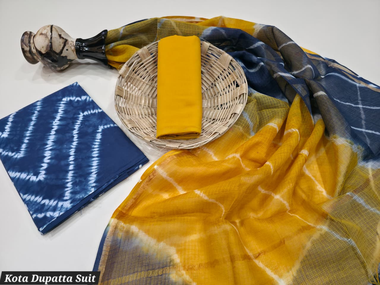 Mustard Yellow & Indigo Blue Dabu Print Cotton Suit with a sheer Kota Doria Dupatta.